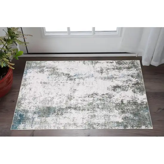 Gray And Ivory Abstract Printed Stain Resistant Non Skid Area Rug Photo 1
