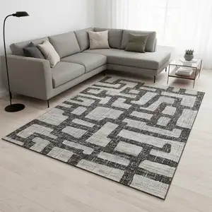Photo of Gray And Ivory Abstract Washable Area Rug With UV Protection