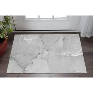 Photo of Gray And Ivory Abstract Washable Area Rug With UV Protection