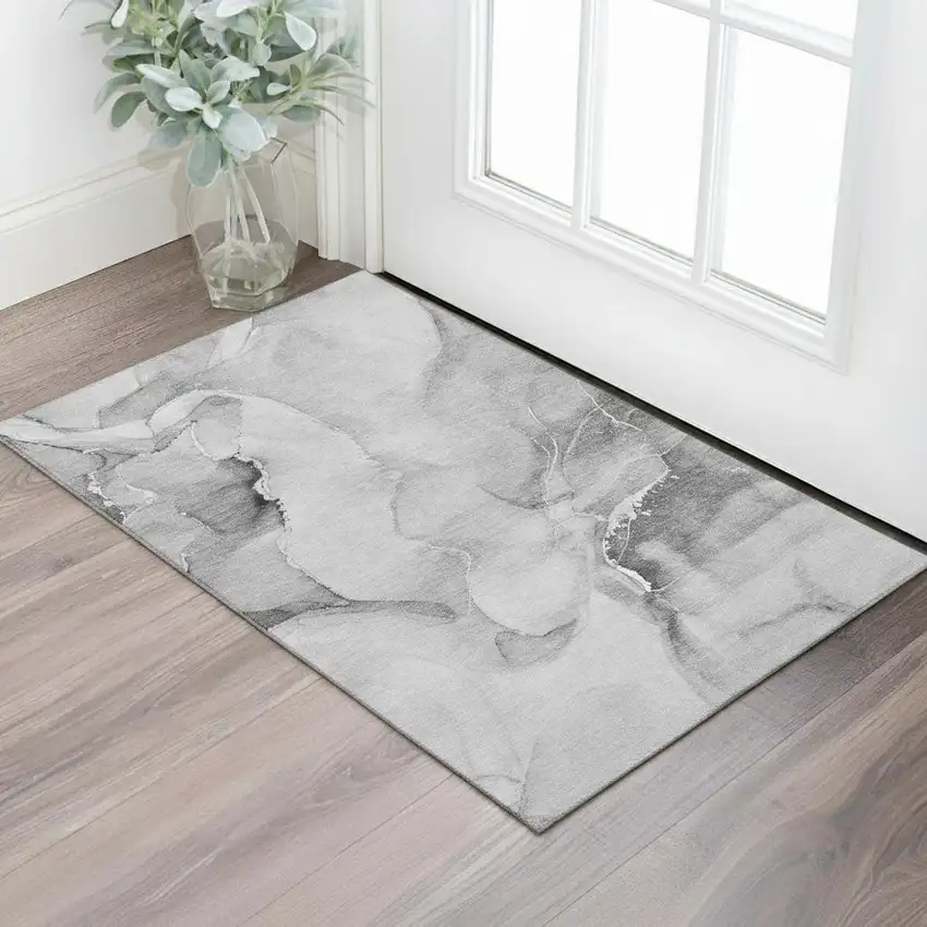 Gray And Ivory Abstract Washable Area Rug With UV Protection Photo 1