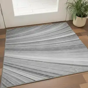Photo of Gray And Ivory Abstract Washable Area Rug With UV Protection