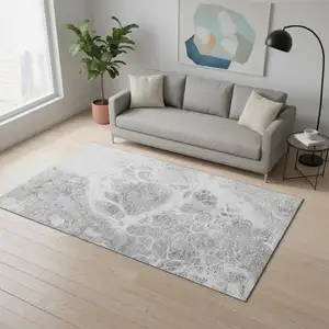 Photo of Gray And Ivory Abstract Washable Area Rug With UV Protection