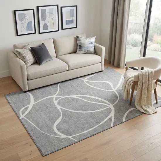 Gray And Ivory Abstract Washable Area Rug With UV Protection Photo 1