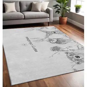 Photo of Gray And Ivory Animal Print Washable Area Rug With UV Protection