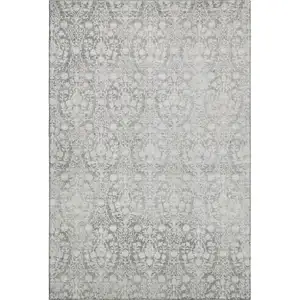 Photo of Gray And Ivory Damask Washable Area Rug With UV Protection