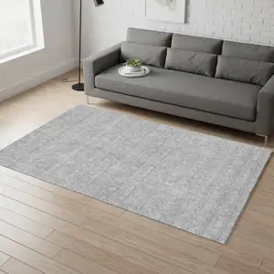 Photo of Gray And Ivory Floral Washable Area Rug With UV Protection