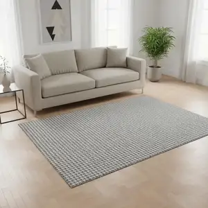 Photo of Gray And Ivory Houndstooth Washable Area Rug With UV Protection