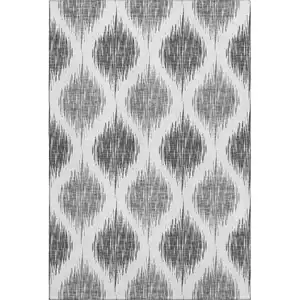 Photo of Gray And Ivory Ikat Washable Area Rug With UV Protection