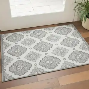 Photo of Gray And Ivory Medallion Washable Area Rug With UV Protection