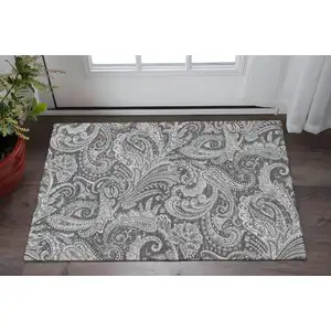Photo of Gray And Ivory Paisley Washable Area Rug With UV Protection