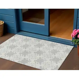 Photo of Gray And Ivory Quatrefoil Washable Indoor Outdoor Area Rug