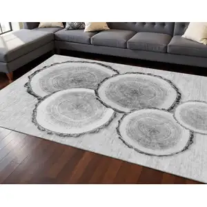 Photo of Gray And Ivory Woodland Lodge Washable Area Rug With UV Protection