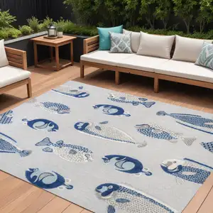 Photo of Gray And Navy Blue Animal Print Indoor Outdoor Area Rug