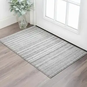 Photo of Gray And Silver Striped Washable Area Rug With UV Protection