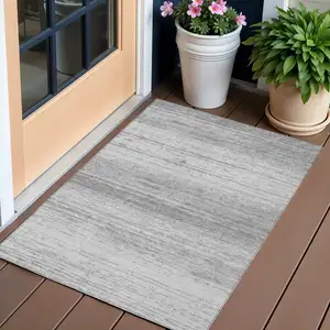 Photo of Gray And Silver Striped Washable Indoor Outdoor Area Rug