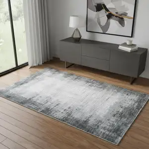 Photo of Gray And White Abstract Distressed Area Rug