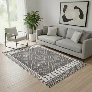 Photo of Gray And White Geometric Distressed Washable Area Rug