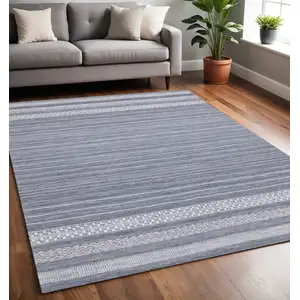 Photo of Gray And White Striped Hand Woven Area Rug