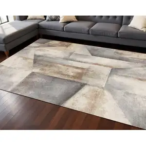 Photo of Gray Beige And Brown Abstract Area Rug