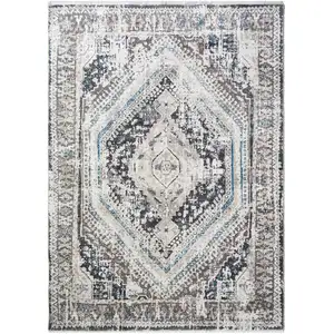 Photo of Gray Beige and Blue Geometric Distressed Area Rug With Fringe
