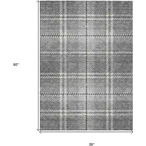 Photo of Gray Black And Ivory Plaid Washable Indoor Outdoor Area Rug