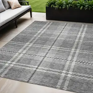 Photo of Gray Black And Ivory Plaid Washable Indoor Outdoor Area Rug