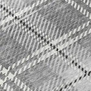 Photo of Gray Black And Ivory Plaid Washable Indoor Outdoor Area Rug
