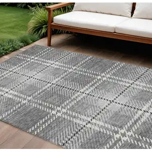Photo of Gray Black And Ivory Plaid Washable Indoor Outdoor Area Rug