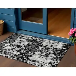 Photo of Gray Black And Ivory Striped Washable Indoor Outdoor Area Rug