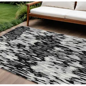 Photo of Gray Black And Ivory Striped Washable Indoor Outdoor Area Rug