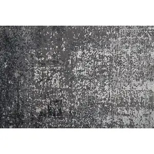 Photo of Gray Black And Silver Abstract Power Loom Distressed Area Rug With Fringe