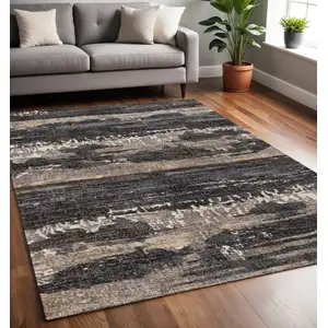 Photo of Gray Black And Tan Abstract Area Rug