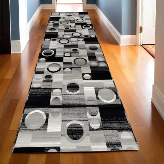 10' Black Gray and White Geometric Power Loom Distressed Runner Rug Photo 1