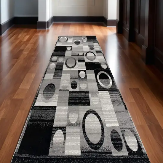 10' Black Gray and White Geometric Power Loom Distressed Runner Rug Photo 1