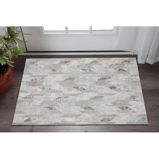Gray Blue And Cream Geometric Distressed Stain Resistant Area Rug Photo 1