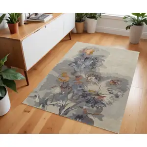 Photo of Gray Blue And Orange Wool Floral Tufted Handmade Area Rug