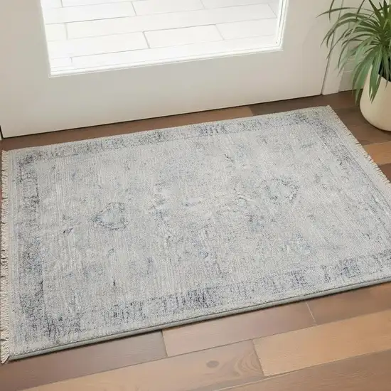 Gray Blue and Taupe Abstract Hand Woven Distressed Area Rug With Fringe Photo 1
