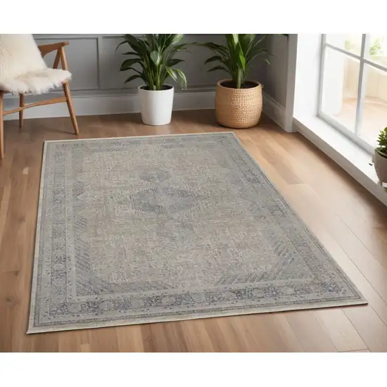 Gray Blue and Taupe Oriental Power Loom Worn Faded Area Rug With Fringe Photo 1