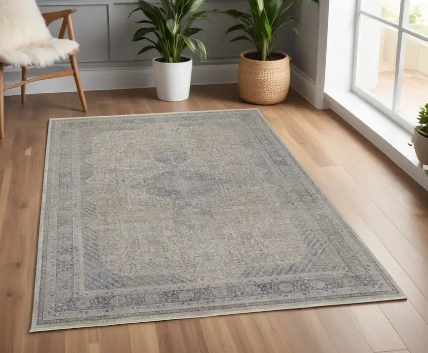 Gray Blue and Taupe Oriental Power Loom Worn Faded Area Rug With Fringe Photo 1