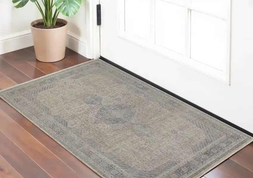 Gray Blue and Taupe Oriental Power Loom Worn Faded Area Rug With Fringe Photo 1