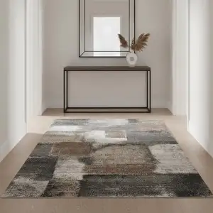 Photo of Gray Brown And Ivory Abstract Area Rug