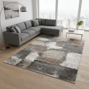 Photo of Gray Brown And Ivory Abstract Area Rug
