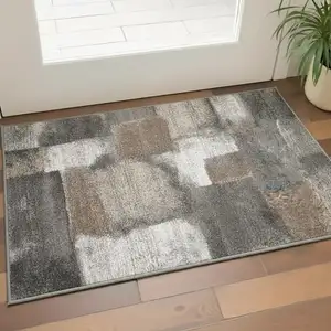 Photo of Gray Brown And Ivory Abstract Area Rug