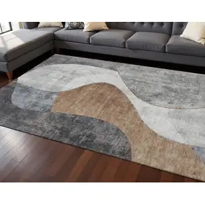 Photo of Gray Brown And Ivory Abstract Washable Area Rug With UV Protection