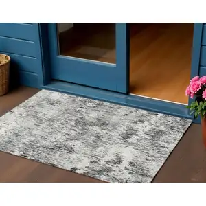 Photo of Gray Brown And Ivory Abstract Washable Indoor Outdoor Area Rug