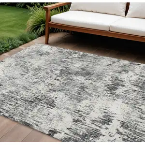Photo of Gray Brown And Ivory Abstract Washable Indoor Outdoor Area Rug