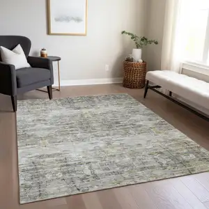 Photo of Gray Charcoal And Gold Abstract Washable Indoor Outdoor Area Rug