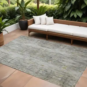 Photo of Gray Charcoal And Gold Abstract Washable Indoor Outdoor Area Rug