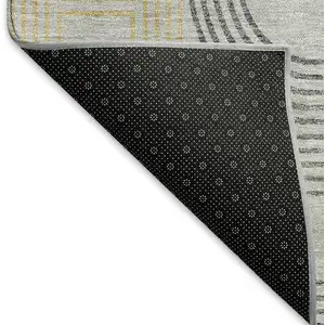 Photo of Gray Charcoal And Gold Geometric Washable Area Rug With UV Protection