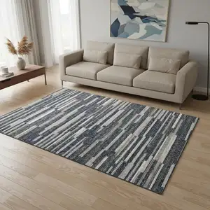 Photo of Gray Charcoal And Ivory Abstract Washable Area Rug With UV Protection